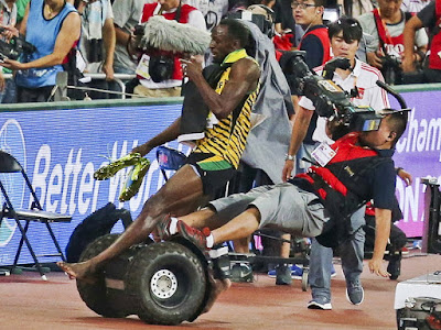 Usain Bolt Is Knocked Over By Means Of Segway Riding Cameraman After Triumphing Gold