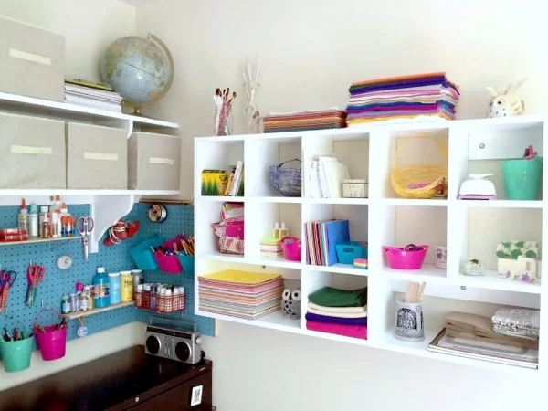 use cubbies and pegboard to organize craft supplies