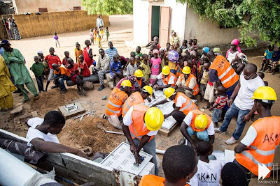 Men at work on Akon Lighting Africa