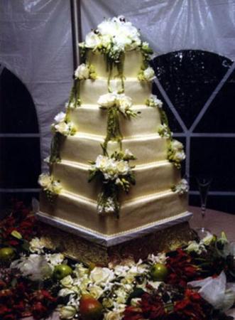 6tier wedding cake made up of white cake with a white chocolateraspberry