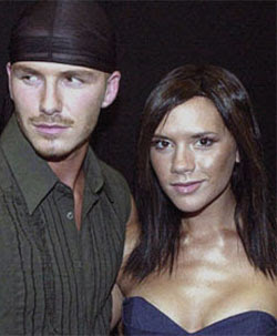 Beckham eyes ex-model, Posh walks out