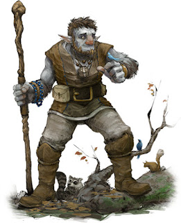 A blue man with brown hair and beard holding a wooden staff. His ears are pointed and he wears simple leather garb and tall boots. He is depicted in nature, with birds and squirrels around his legs.