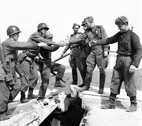 The Link-Up. The “Meeting at the Elbe” River on Apr. 25, 1945 between the American 69th Infantry Division and the Soviet 58th Guards Division, Torgau , Germany. For a brief moment, the world was united against tyranny. Photo: The Fighting 69th Infantry Division Association