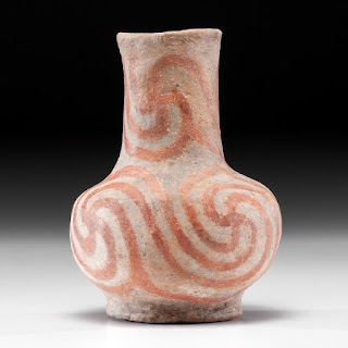 Nodena phase Mississippian culture pottery with spiral swastikas.