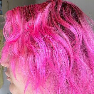 Wavy bright hot pink hair.