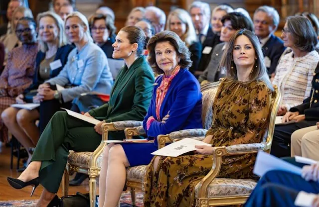 Princess Sofia wore a new guthern burnout floral gold midi dress by French Connection. Crown Princess Victoria wore a green suit