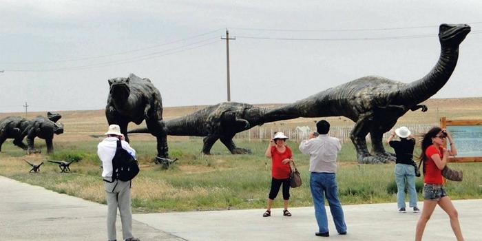North of China on the Sino-Mongolian border, near the town of Erenhot (also known as Erlian), you will find the statues of two towering Brontosauruses. The two dinosaurs are located on either side of the main highway, their long necks stretching to the other, until the two dinosaur's mouth meet as if to share a kiss. Each dinosaur statue is 34 meters wide and 19 meters high. The span of the two together reaches 80 meters. The ground near the kissing couple is littered with many dozen smaller statues of dinosaurs of all shapes and sizes.