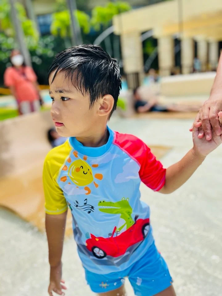 Little boy enjoying the swimming pool in Pico de Loro