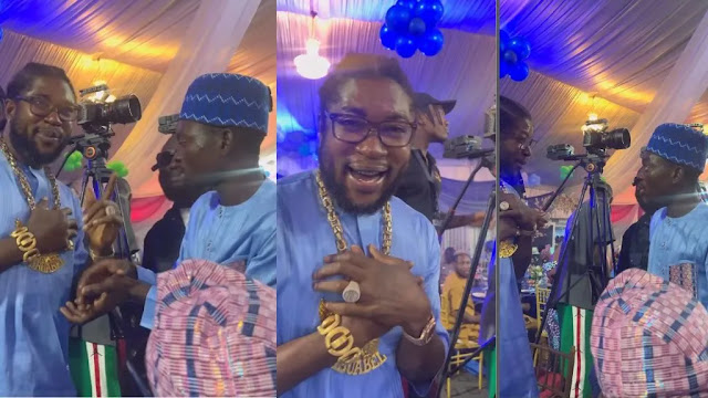 Funny moment real estate mogul Abu Abel holds his Gold chain to his chest after spotting Erekere at an event (Video)