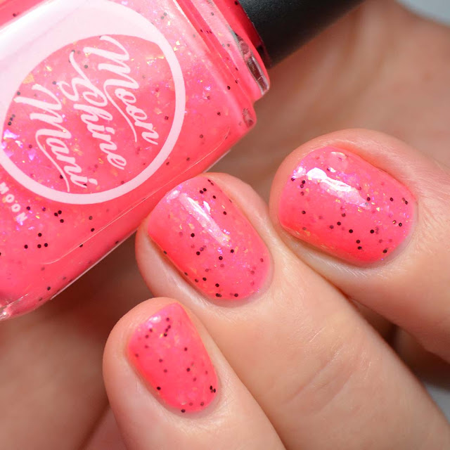 neon pink nail polish with flakies swatch