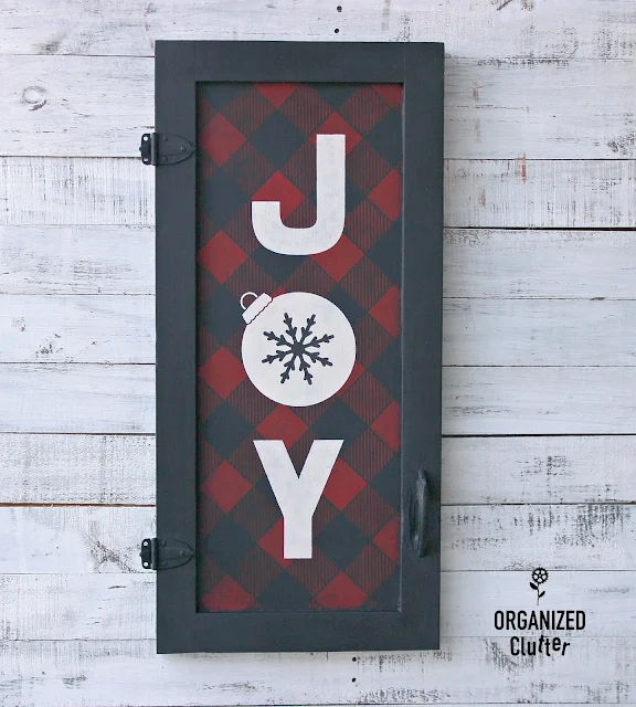 A Vintage Cabinet Door Buffalo Check Christmas JOY Sign #oldsignstencils #stenciling #rusticChristmas #buffalocheck #Christmassign #garagesalefind #upcycle #cabinetdoor