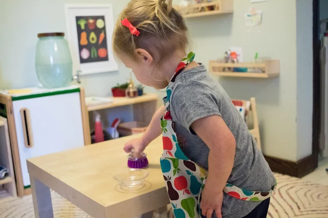 Montessori babies and Montessori toddlers love practical activities. These sorts of activities help to foster independence and make them an active member of the household. Here are 4 steps to introduce practical life activities babies and toddlers in your home.