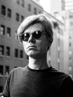 Andy Warhol wearing dark glasses