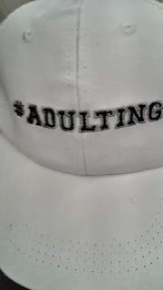 Hat with the hashtag adulting