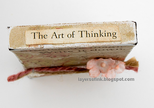Layers of ink - Altered Notebooks Tutorial by Anna-Karin Evaldsson. Add words to the spine.