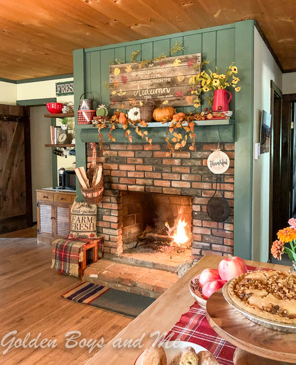 Backwoods Green by Benjamin Moore paint on brick fireplace at a mountain cabin.