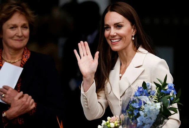 Kate Middleton wore a new lace detail crepe belted midi dress by Self Portrait. Annoushka drop earrings