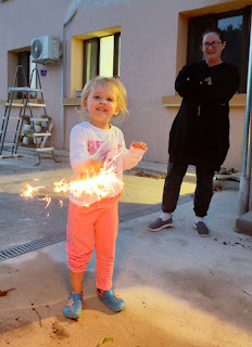 Rosie sparkling with her sparkler