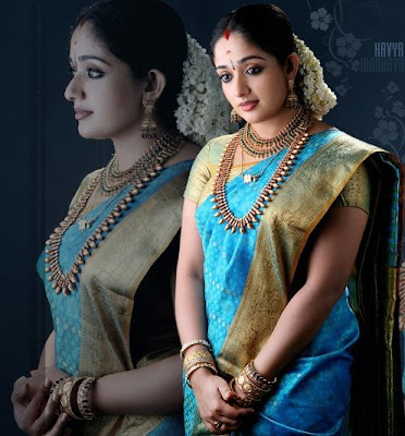 South Indian actress Kavya Madhavan in beautiful blue colour wedding saree