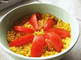 humus spread with tomato slices