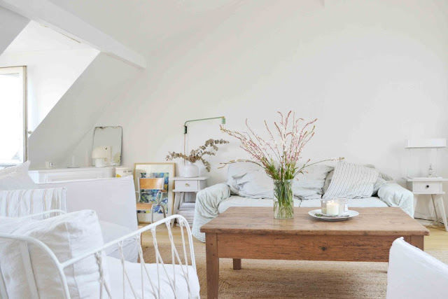 White Living room in 1650  Marais home in Paris by Lucille Gauthier-Braud