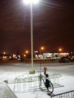 bike under the light in the snow