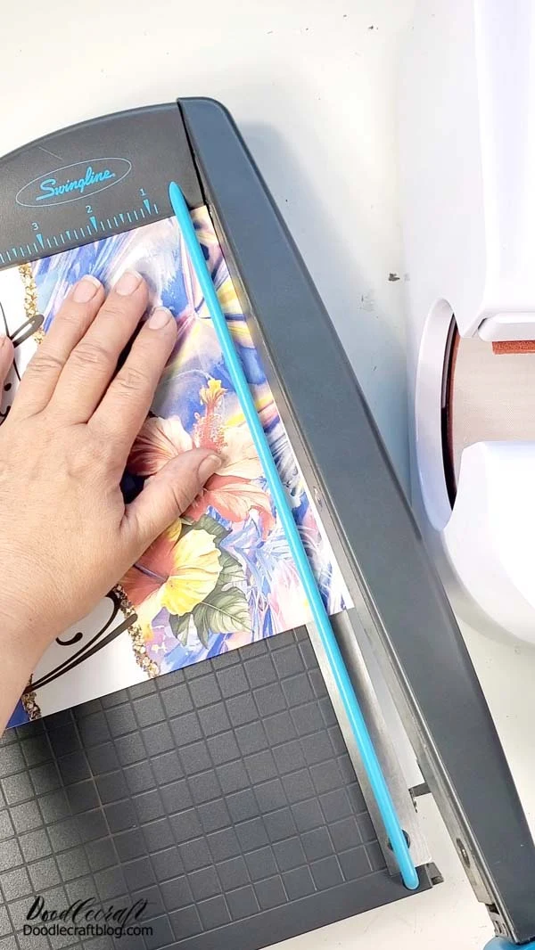 Use your paper cutter to trim the edges carefully around the sublimation print.   Cutting those edges perfectly is key to a good sublimation print, so the edges and seam line up flawlessly.   These wraps are seamless, so they should line up in the back absolutely perfect!