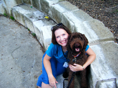 I've got my arm over Alfie as we sit on a limestone block together; we're both smiling and looking up