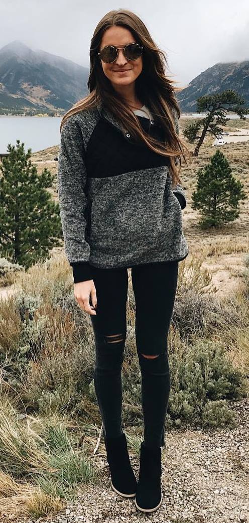 trendy fall outfit / sweater + rips + boots