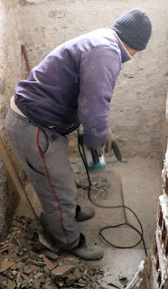 Bekir removing the old toilet