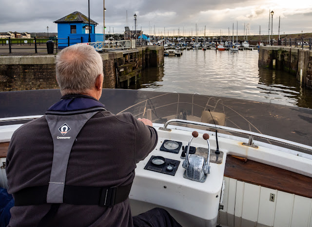 Photo of Phil steering Ravensdale back into Maryport Marina after Saturday's fishing trip