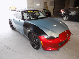 Mazda Miata Race Car before dent repair & overall paint job at Almost Everything Auto Body.