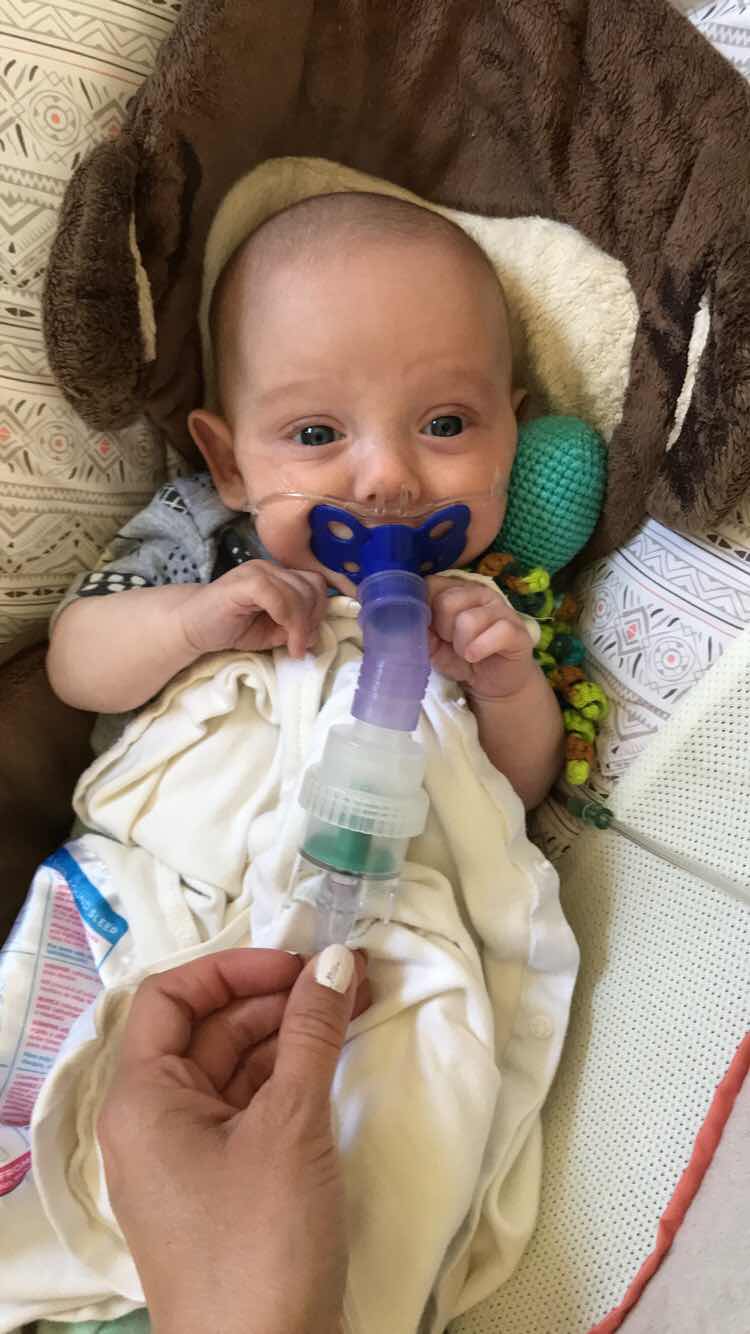 loving his pacifier nebulizer 