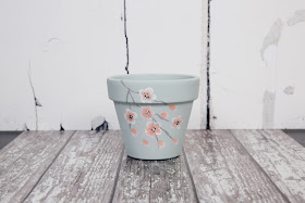 Update any home or garden with this beautiful blossom covered pot decorated using the step by step painting kits from You Can Folk It 