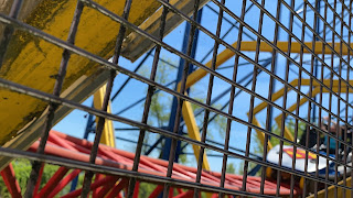 Superman The Ride Roller Coaster Train Passing Through Superman Logos Six Flags New England