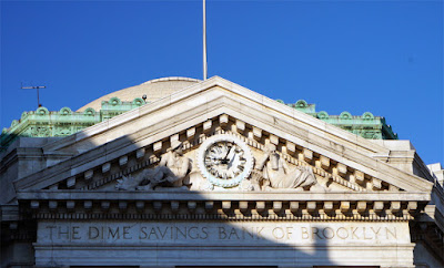 Closeup of pediment over entrance of Dime Savings Bank in Downtown Brooklyn