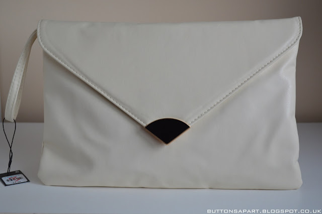 a picture of a cream clutch from primark