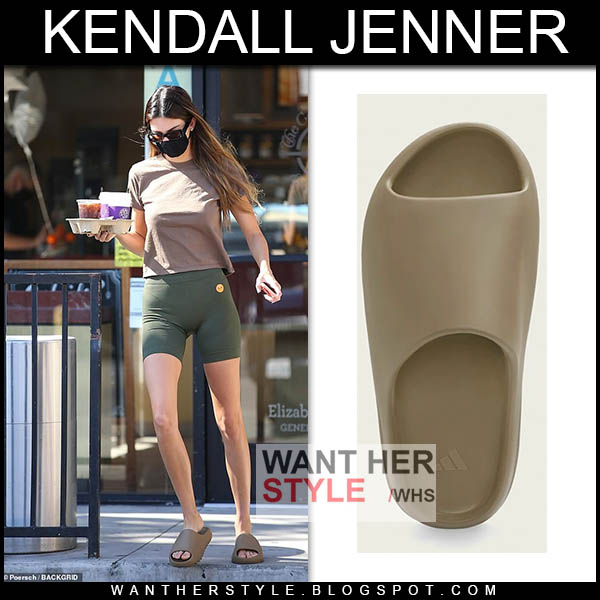 Kendall Jenner in green shorts and khaki slides