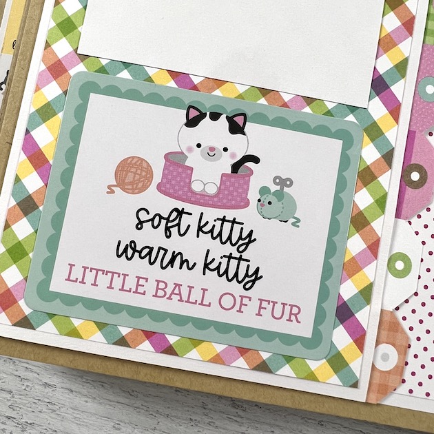 Kitty Cat Scrapbook Album page with yarn ball, cat, and rainbow plaid paper