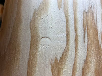 Bolt head marked into the wood