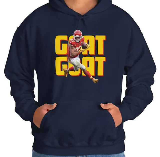 A Hoodie for Men and Women With NFL Player Travis Kelce Holding a Duke Running and GOAT Text in The Background
