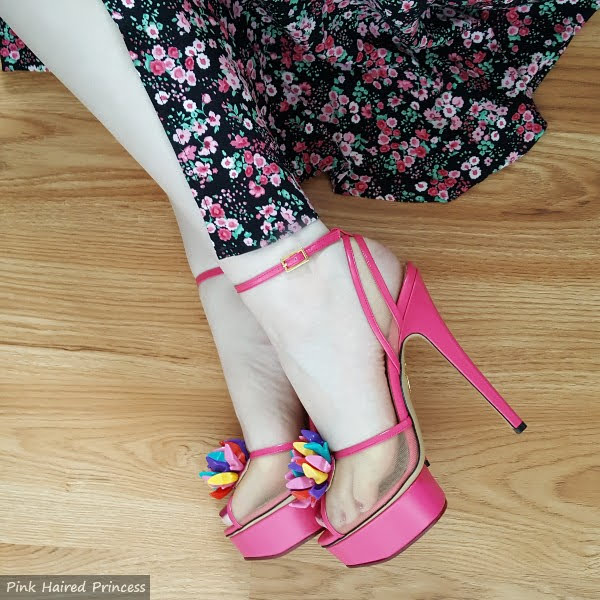 wearing pink Barbie platform shoes with pink floral dress