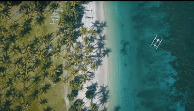 A royalty free of aerial drone shot of best beach to visit in indonesia - Nipah beach Lombok Island