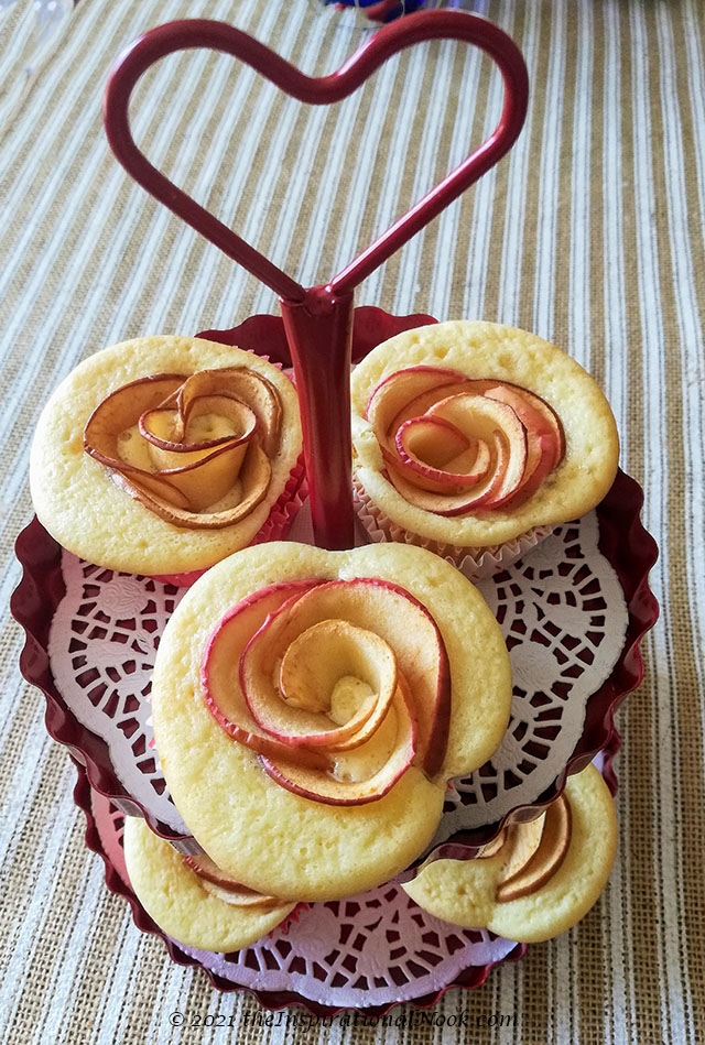 vanilla cupcakes, rose cupcakes on a white doily in a heart cake stand, apple rose cupcakes, apple cupcakes, box cupcake hack,  no icing, no frosting, without frosting