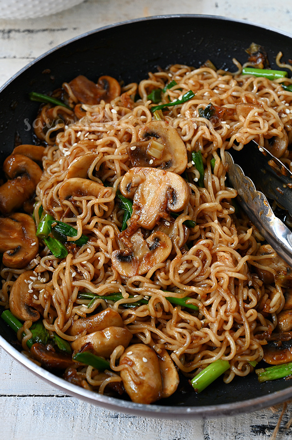 a close p of a pan with mushroom ramen