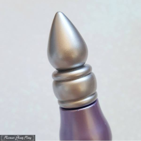 close up of silver pointed lid on Urban Decay Eyeshadow Primer Potion genie bottle