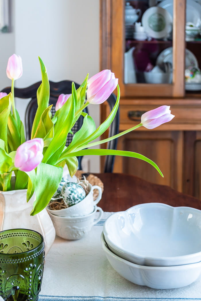 pink tulips, pine hutch, ironstone bowls