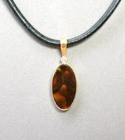 Custom made fire agate pendant for sale at Payne's Custom Jewelry