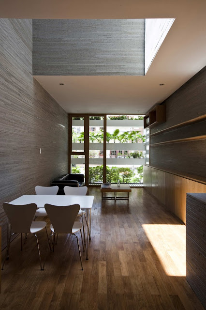 Photo of modern dining table on the first floor of amazing green home