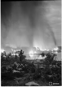 A Finnish soldier looks at the burning of the Rovaniemi town, on October 14, 1944.